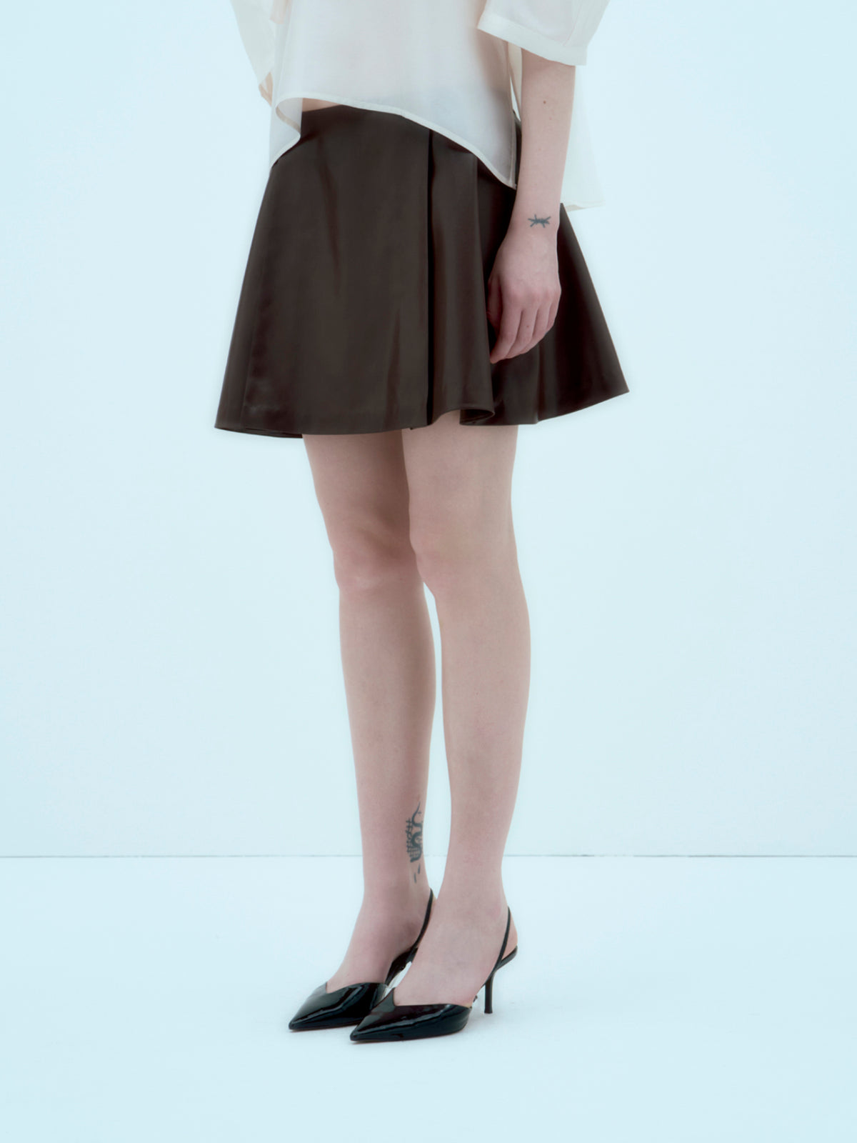 [ARIK.] [25SS] ALKES Panel flare skirt Umber Brown