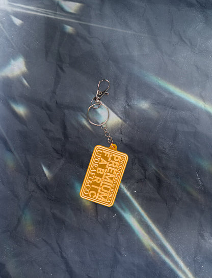 LOGO PATCH ACRYLIC PENDENT ACC MIXED -ORANGE