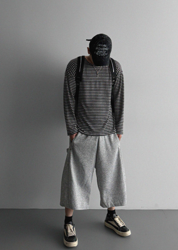 MAGNOLIA Melange Border Raglan Long Sleeve Top BLACK 正面