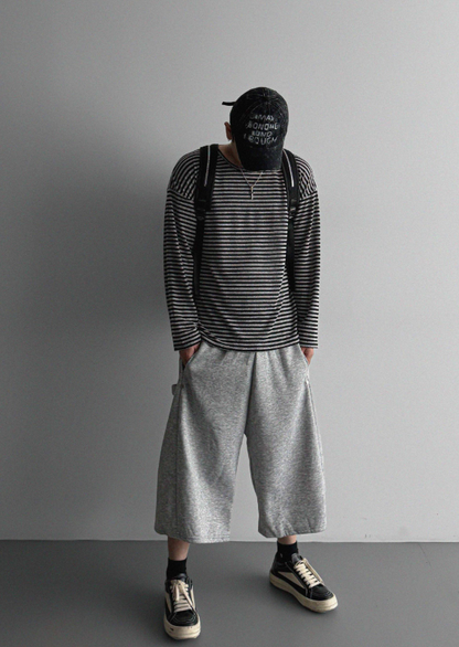 MAGNOLIA Melange Border Raglan Long Sleeve Top BLACK 正面